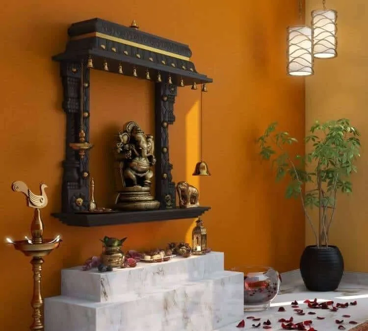 black mandir with idol, plants and decorative items