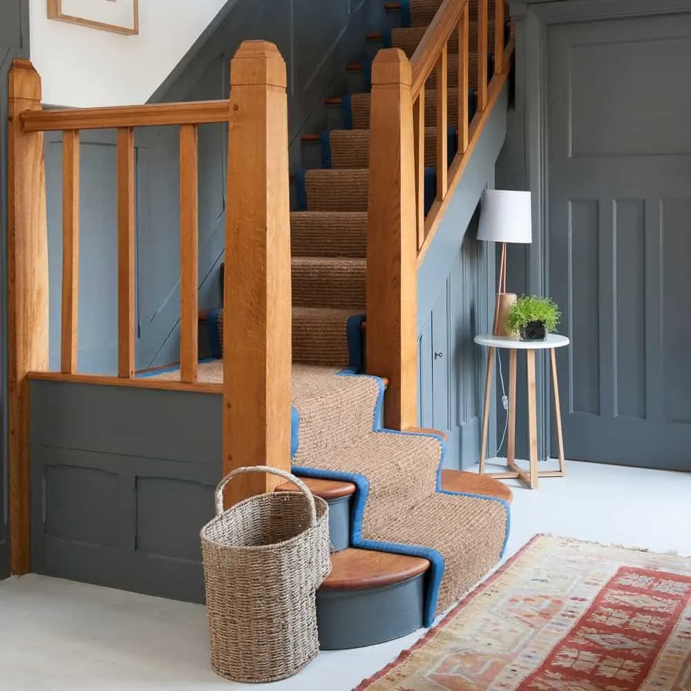 wooden staircase with mat