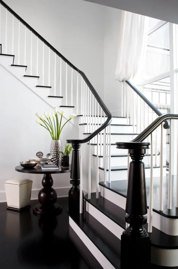 Staircase with black railing and steps
