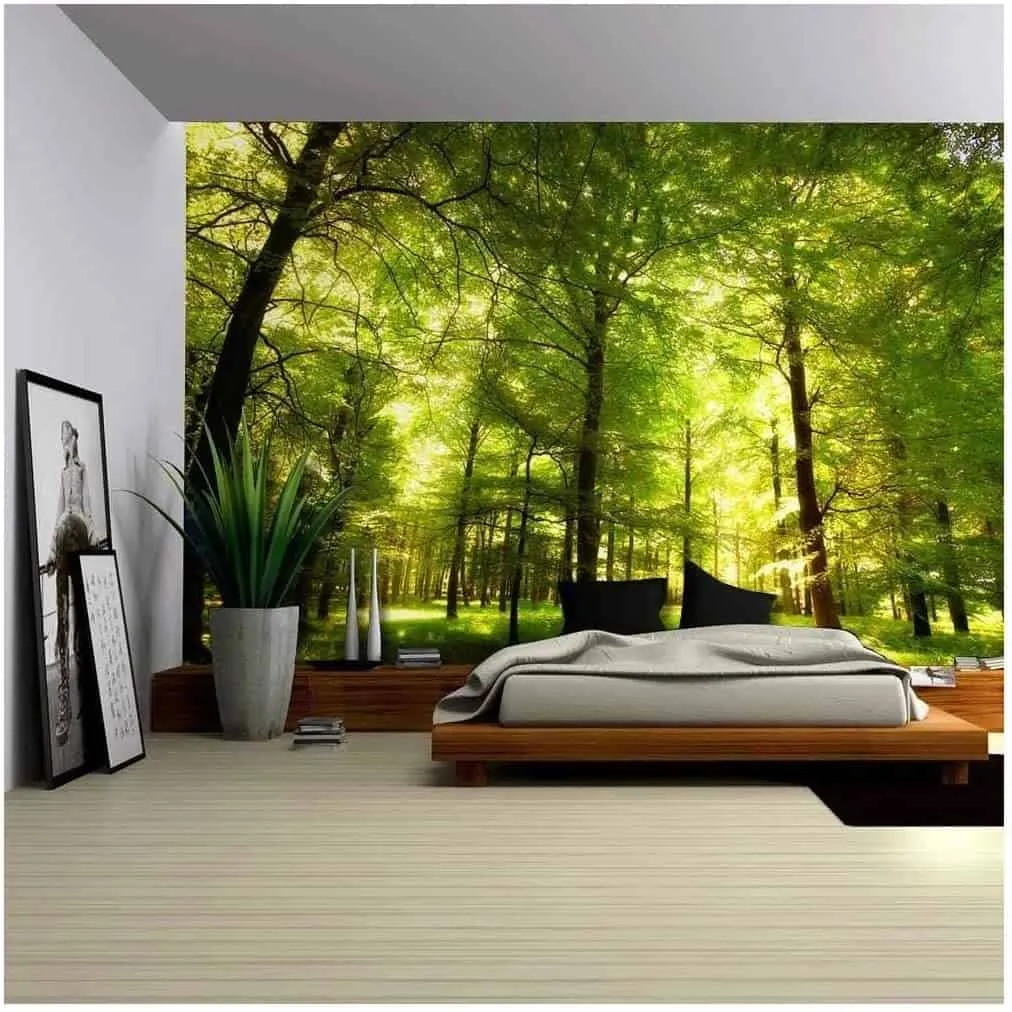 a bedroom with wooden flooring, picture frames and 3D wall stickers.