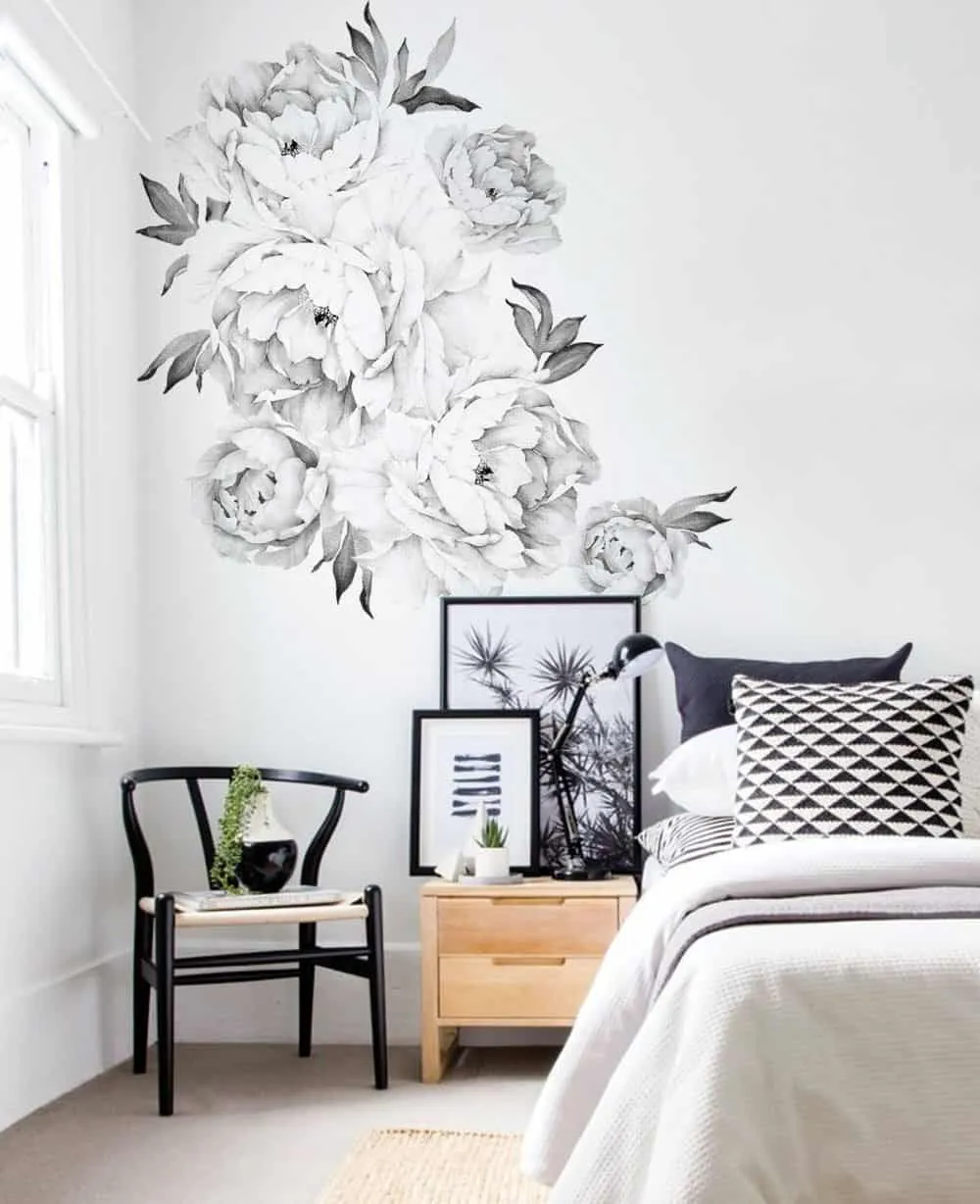 white and black floral 3D hall or bedroom wall sticker in a bed room with wooden furnishing.