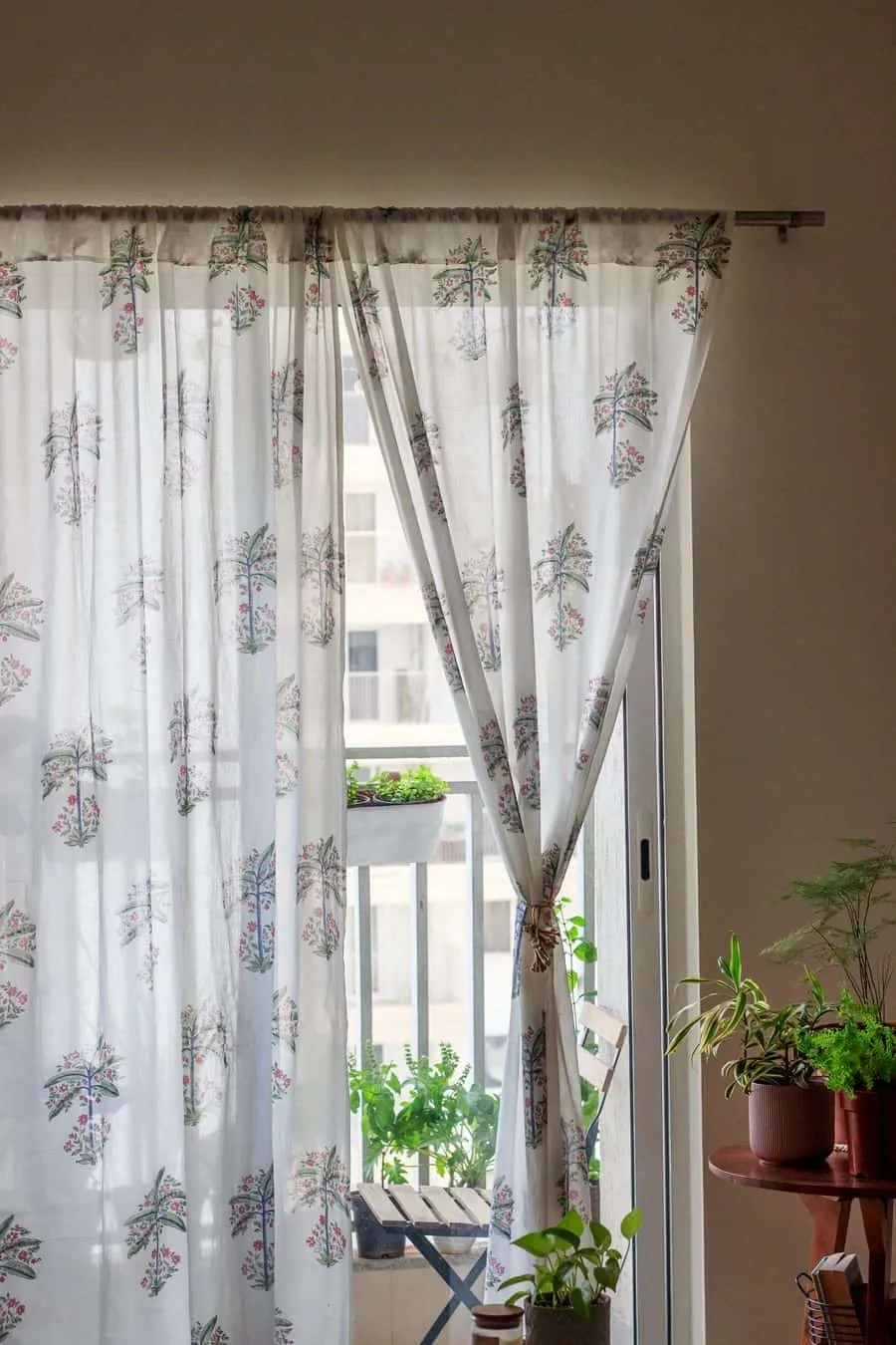 Printed white curtains with plants decor