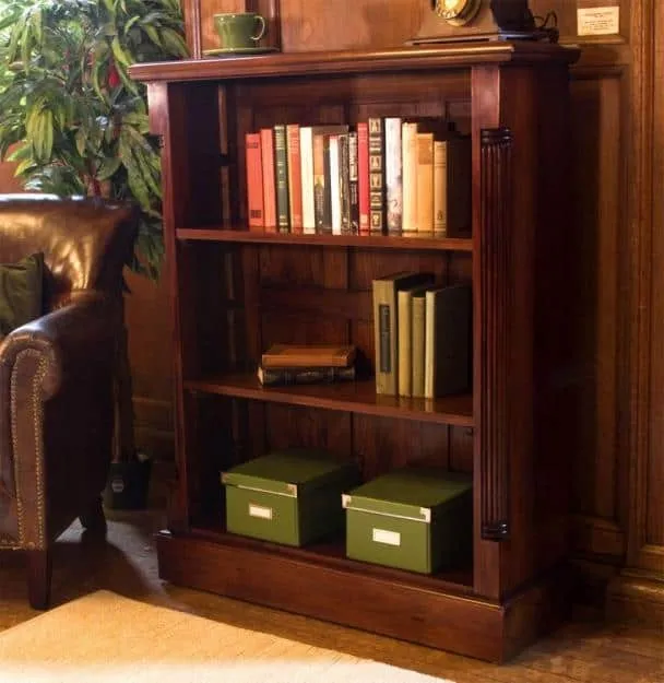 dark brown wooden bookstand, vintage style, room setting, books and other articles arranged