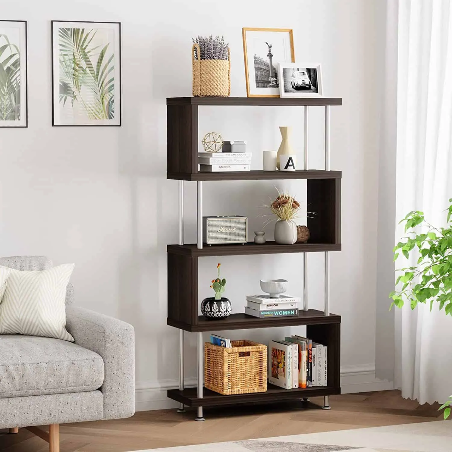 dark brown zigzag bookcase, articles and books arranged, room setting, sofa, wall hangings