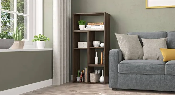 dark brown wooden bookcase, room corner, white curtains, grayish green walls, window, gray sofa
