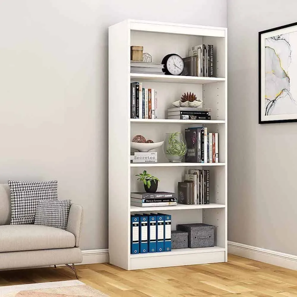 white straight bookcase with books and showpieces, off white walls