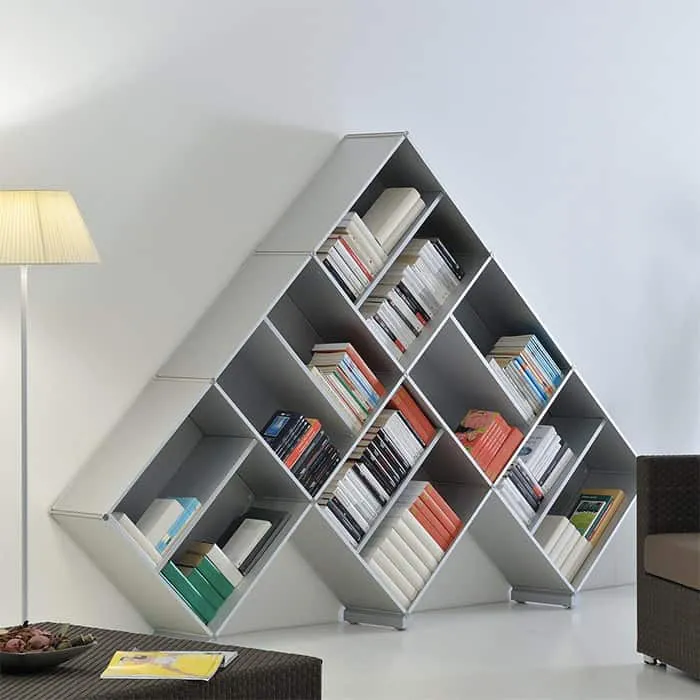 light gray furniture, colourful books arranged, inverted V shaped, lampstand, room setting