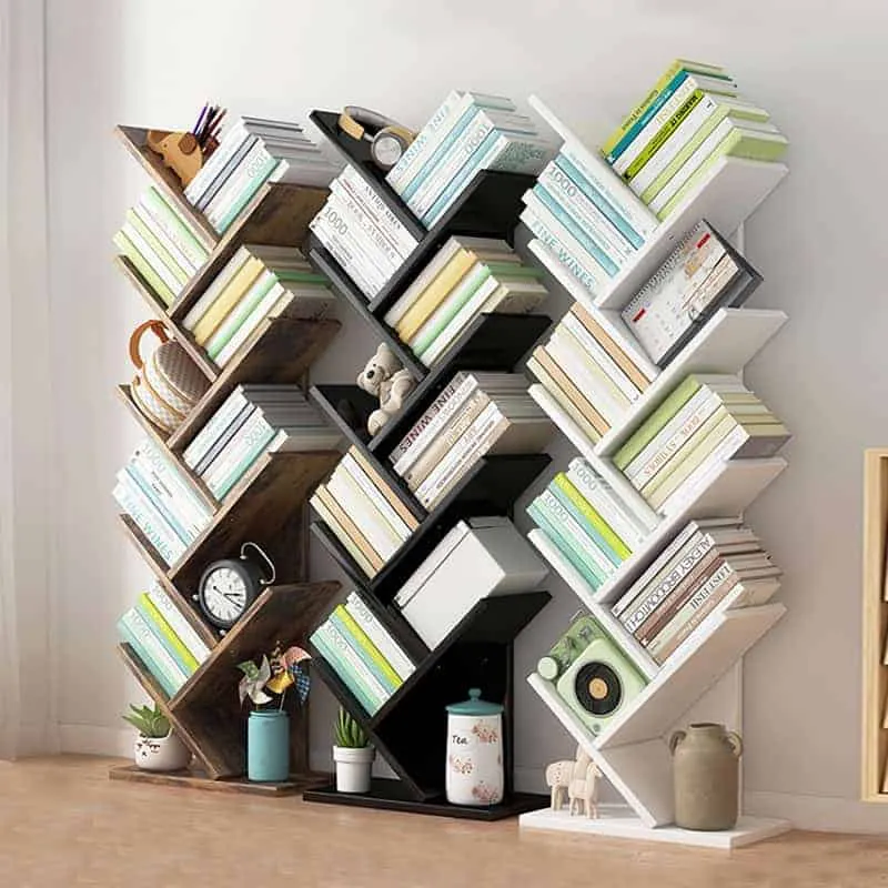 brown, black, white angular bookcases, colourful book covers, articles arranged, room setting