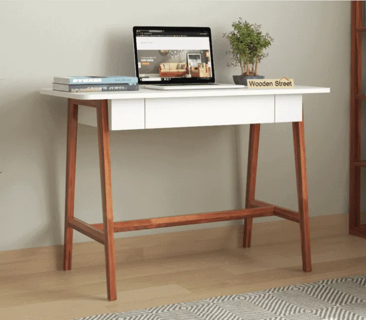 off white drawer, brown wooden base furniture, laptop, small plant