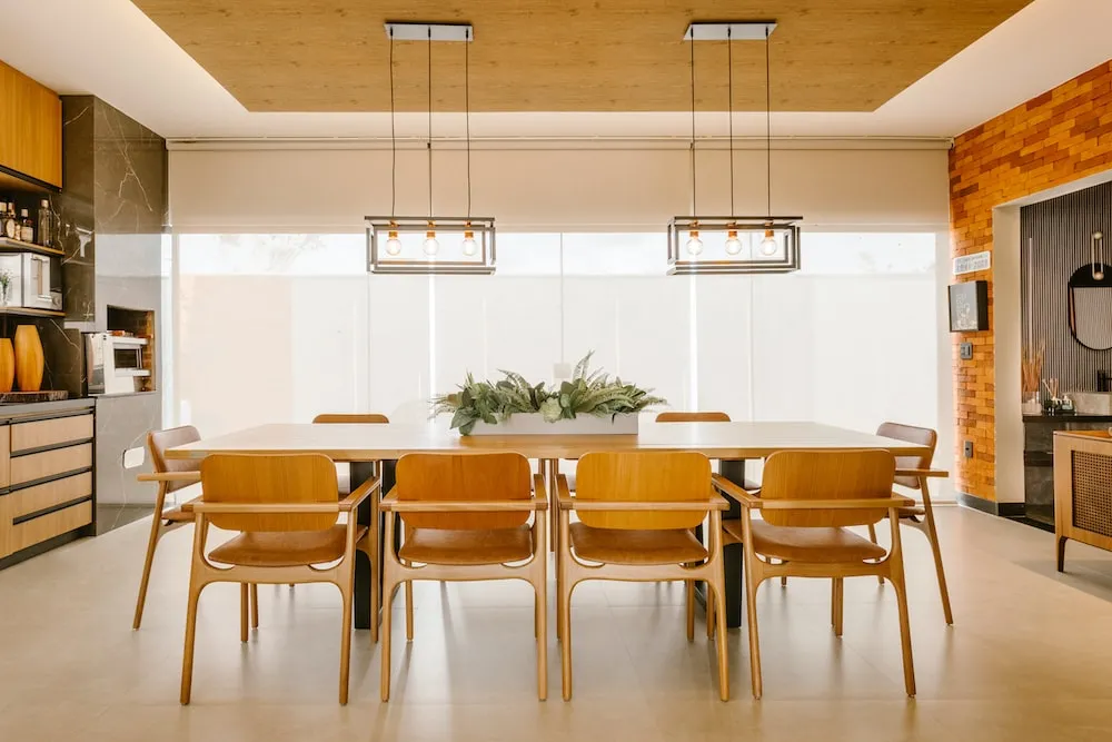 Elegant dining room with multiple layered, wooden, chairs, table, flooring