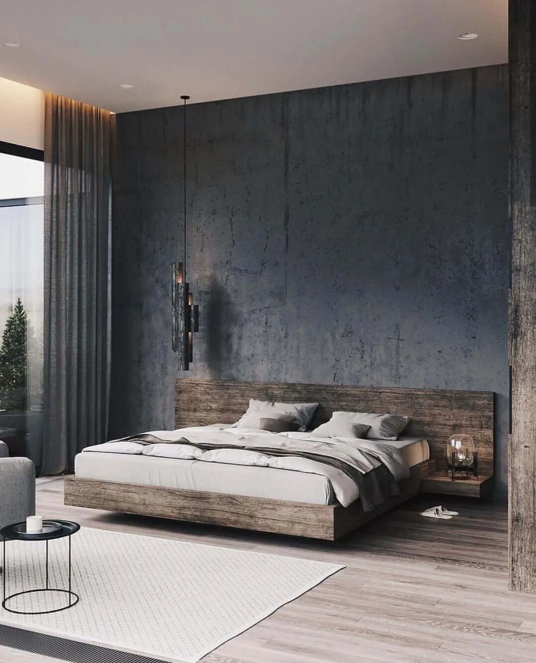 This bedroom design combines the masculine ruggedness of dark colors and pairs it with beautiful texture rich walls and furniture