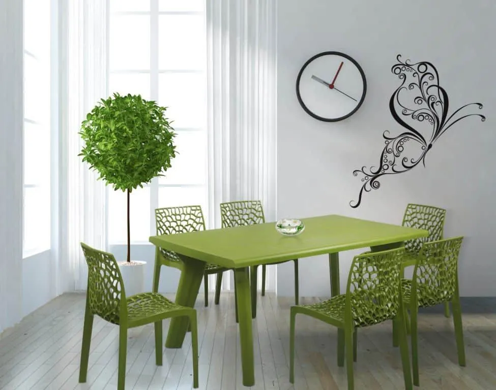 green rectangle 6 seater plastic dining table set in a decorated dining room