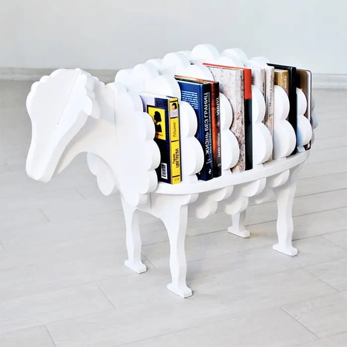 white sheep shaped bookcase, books