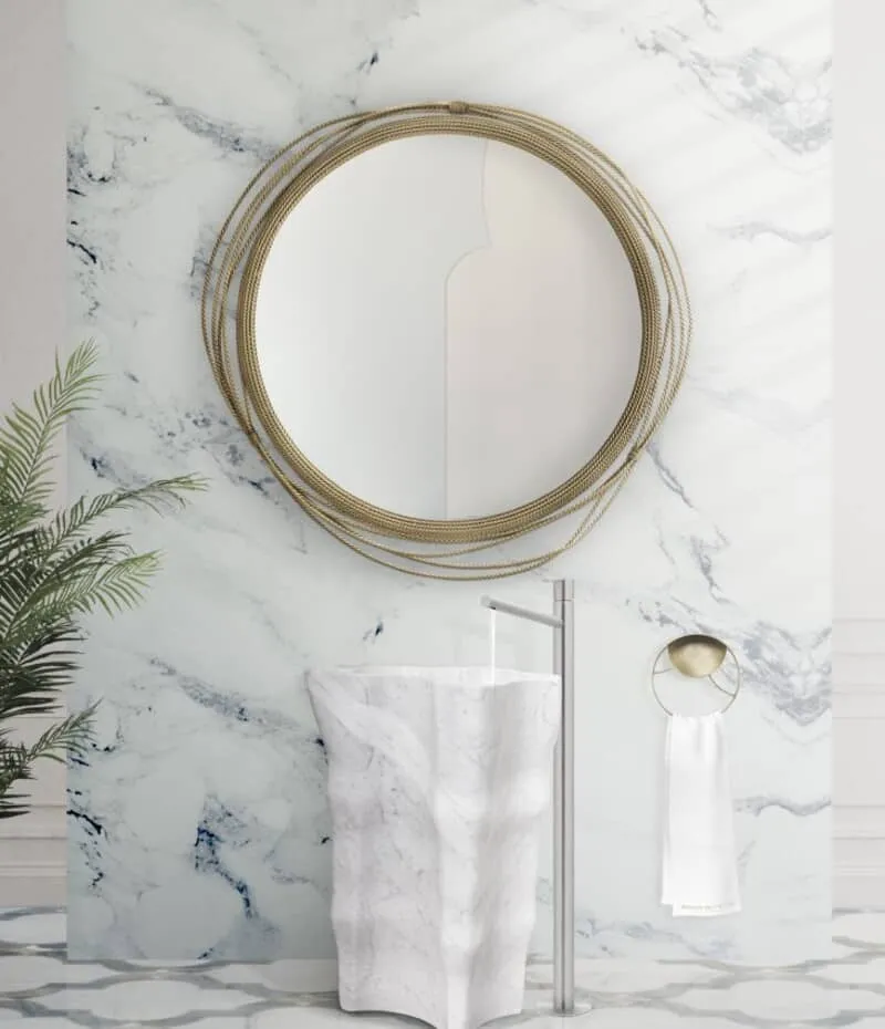 white pedestal washroom with a mirror