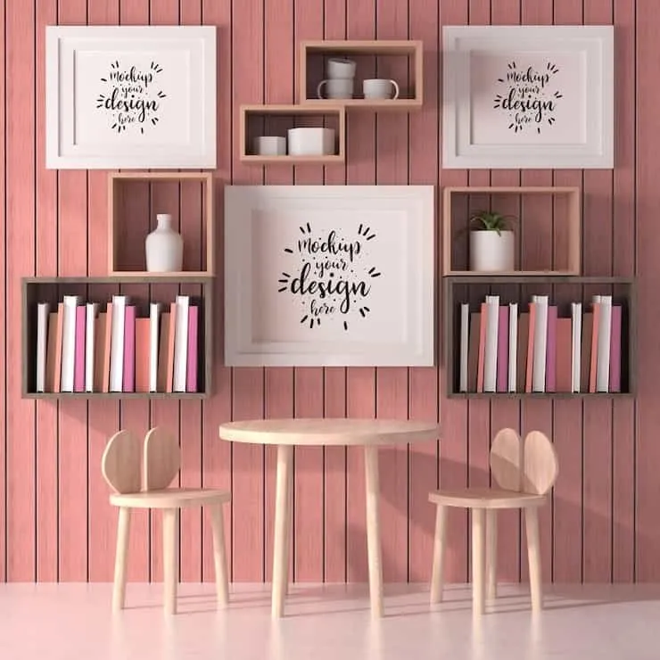 pink wall with wooden furniture floating shelf and paintings