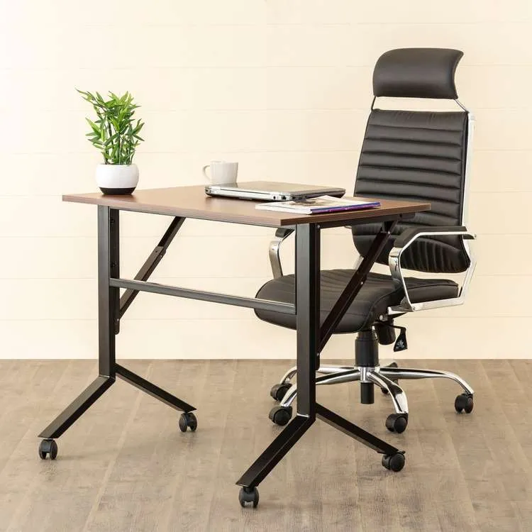 office desk with laptop, office chair, indoor plant, folding furniture