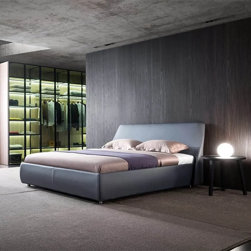 grey double bed, side table, night lamo, closet, textured walls and floor