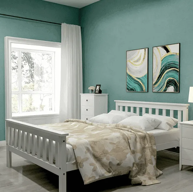 bluish green walls, white bed, white pillows, white bedsheets, wall hangings, window, curtains