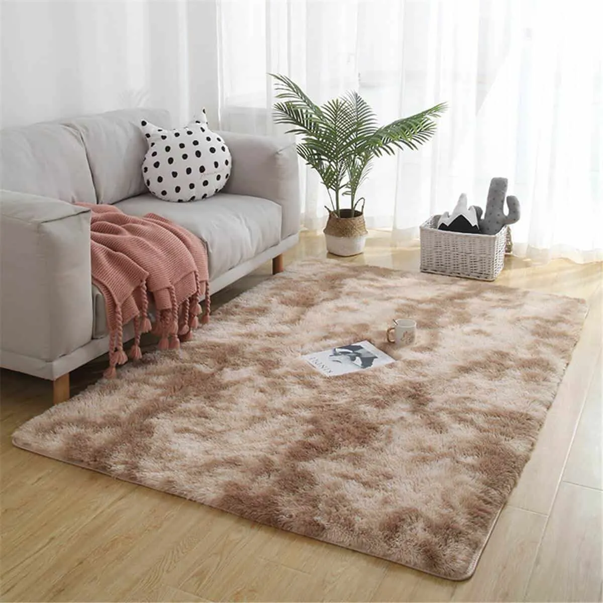 comfy cozy rug in brown earthy tone with a white sofa