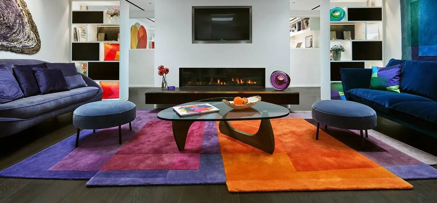 multicolored ground covering with blue furnishing in livingroom