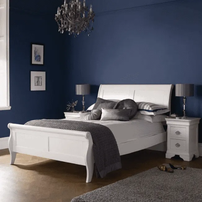 white panel double size bed design, blue walls, chandelier