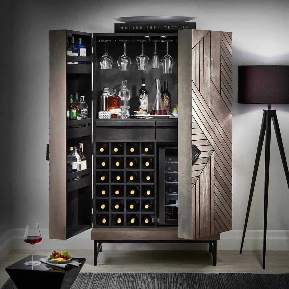 wooden cabinet with black interior finish and liquor bottles.
