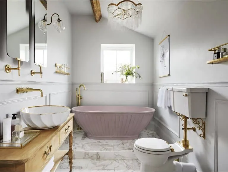 luxury bathroom with bathtub and crystal chandelier