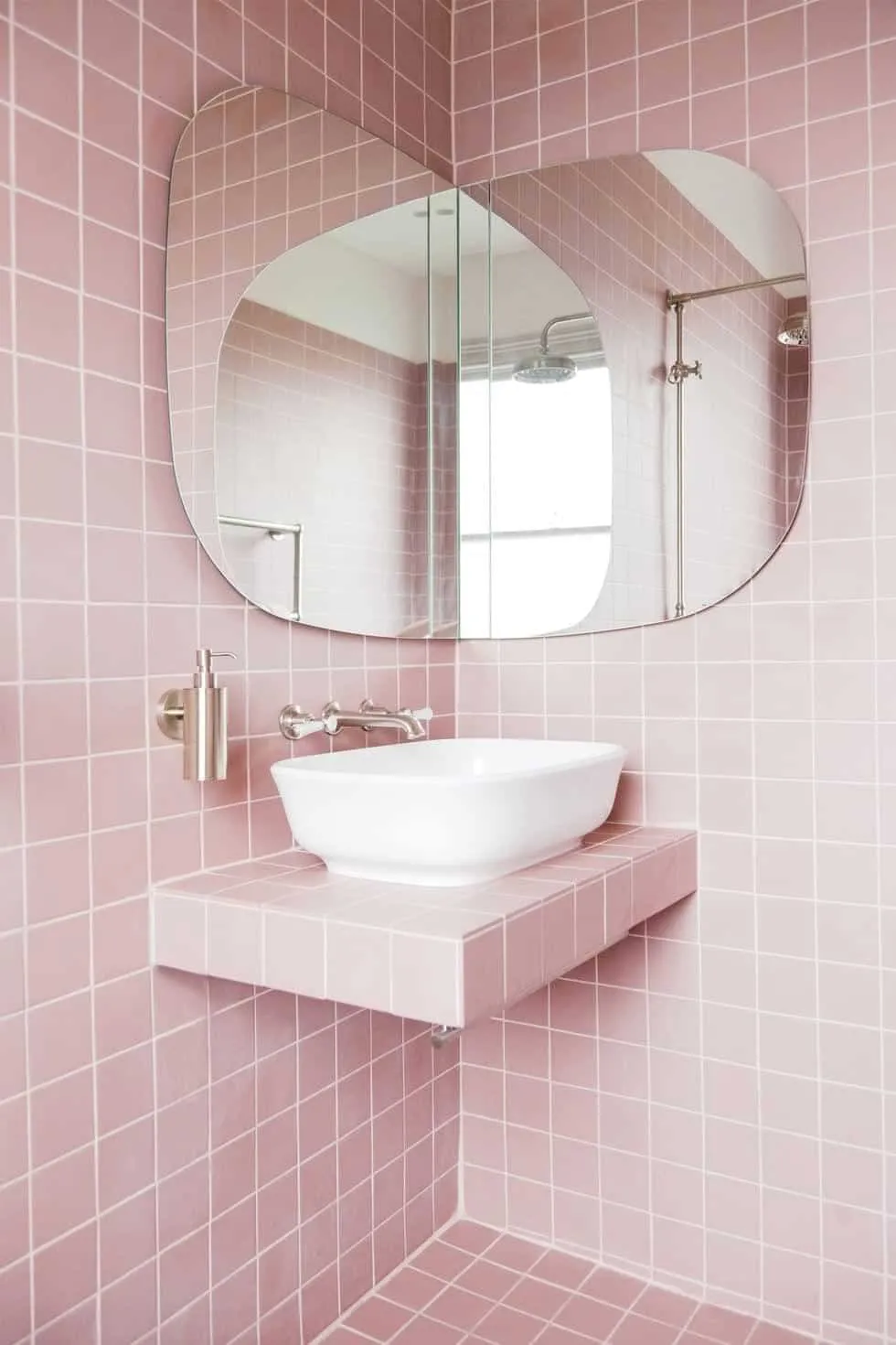Baby pink tiles in bathroom
