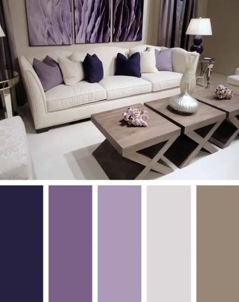 A living room with a white sofa, purple cushions and grey coffee table
