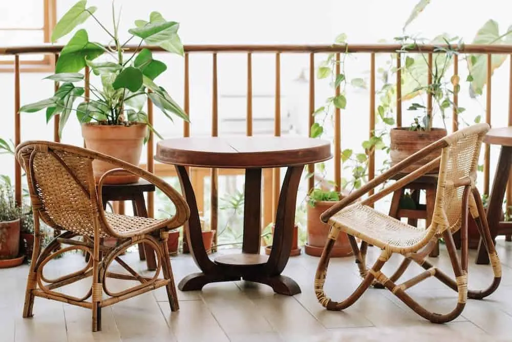 rattan chair, table, plant in balcony