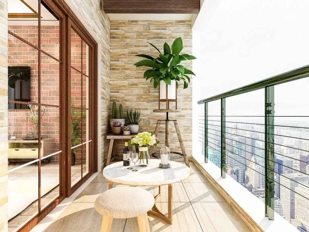 balcony with white table and plant