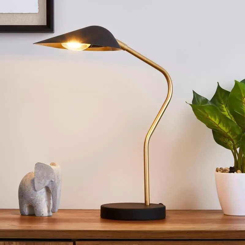 brown table with potted plant, light and animal shaped accessory