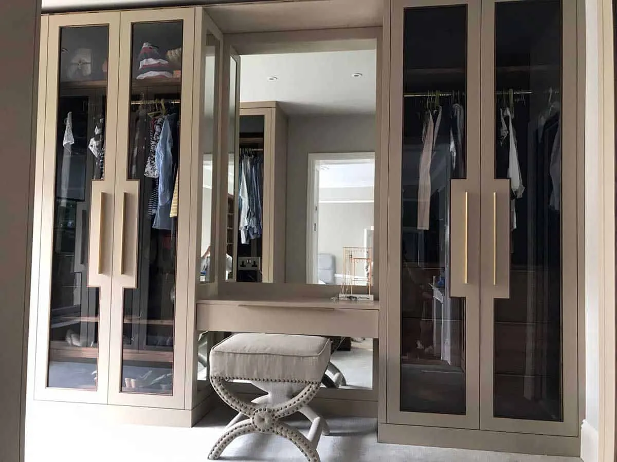 brown closet with built in dressing table
