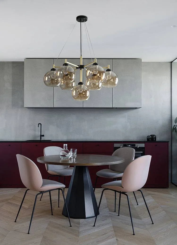 chandelier with pink chair and table