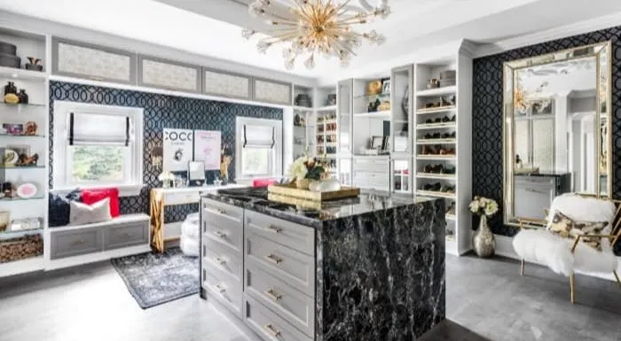 granite vanity counter with a beautiful chandelier in the luxury walk-in wardrobe