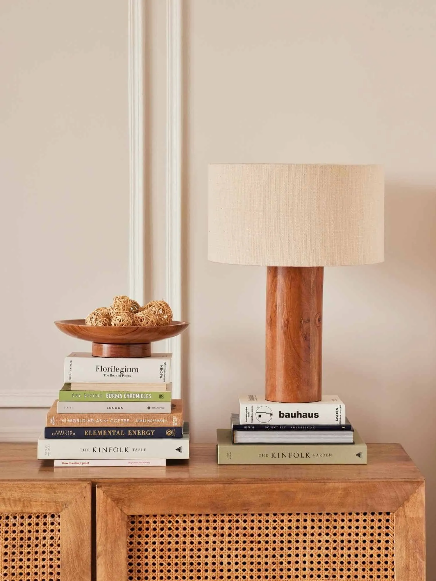brown table lamp on a table with books online