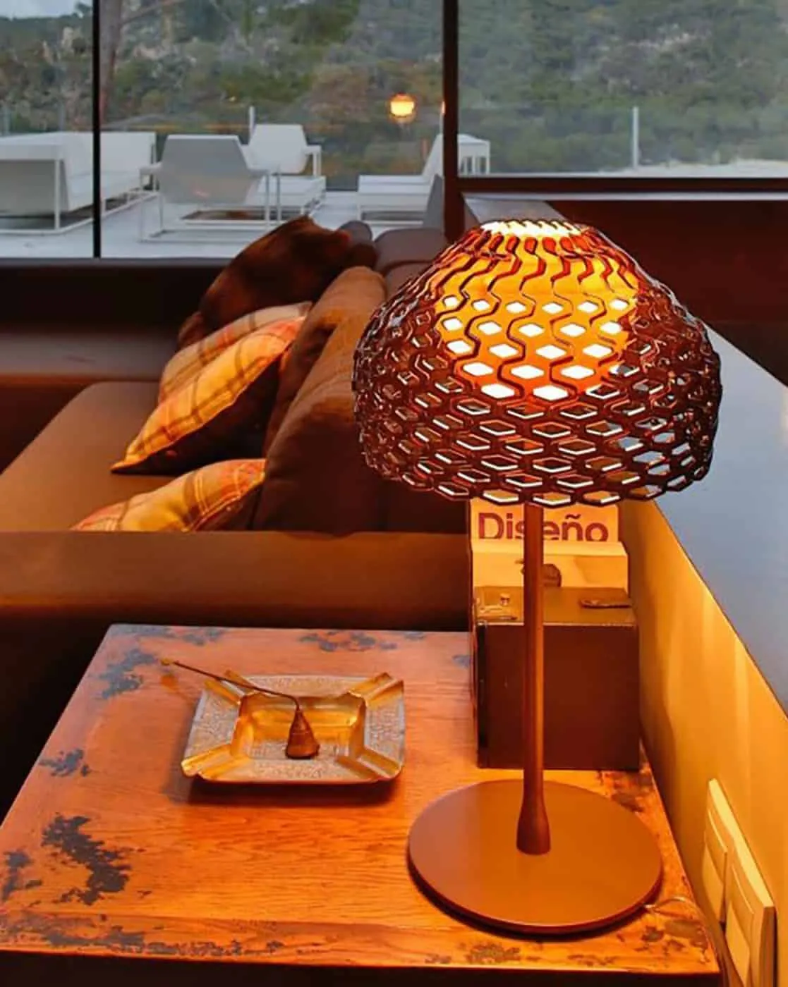 glass lamp on brown table 