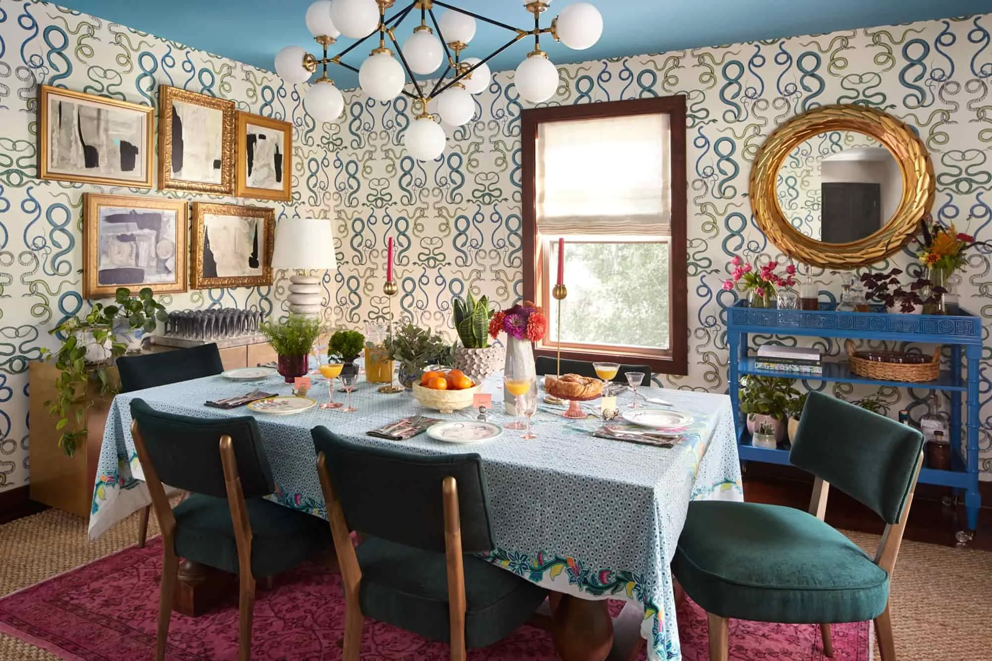 eclectic dining area design, with wallpaper, ceiling light, table, chair, wall art, kitchen decoration