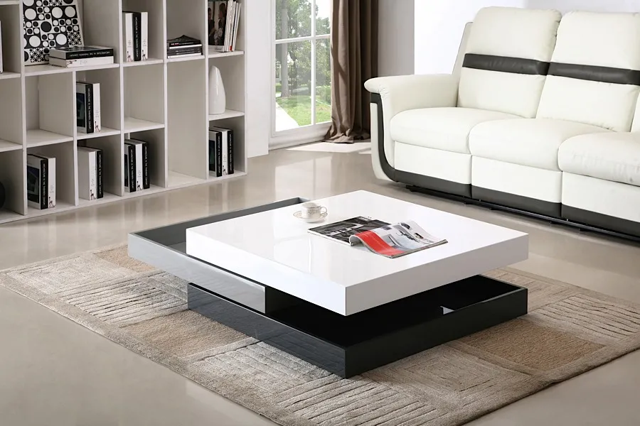 square swivel rotating modern centrepiece, white and black colour combination, white sofa, book shelf, in a living room, carpet, magazine 