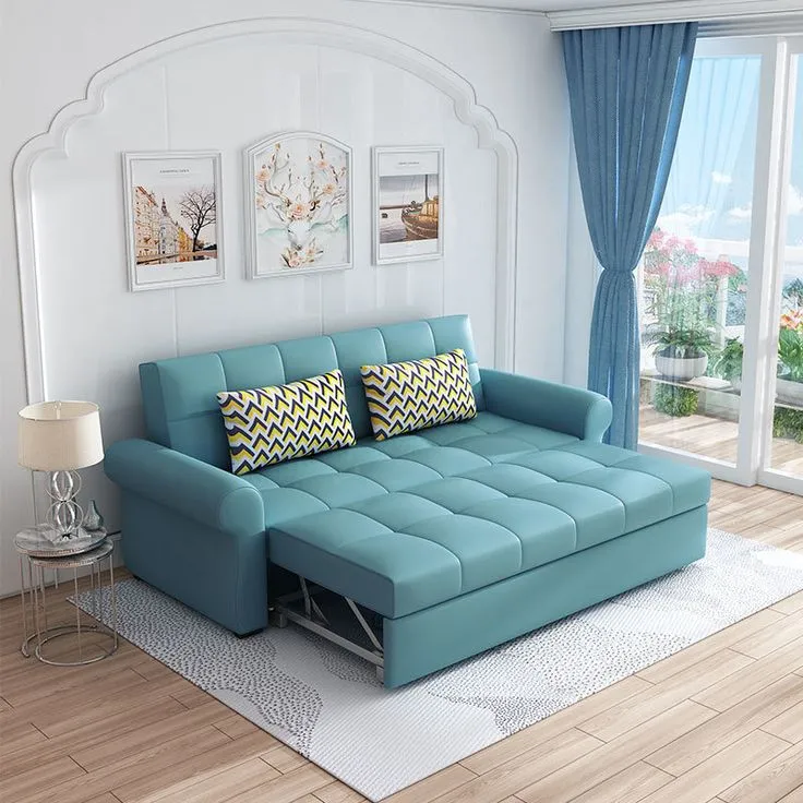 aqua blue pull out sofa cum bed, wooden laminated floor, white carpet, white walls, blue curtains, cushions