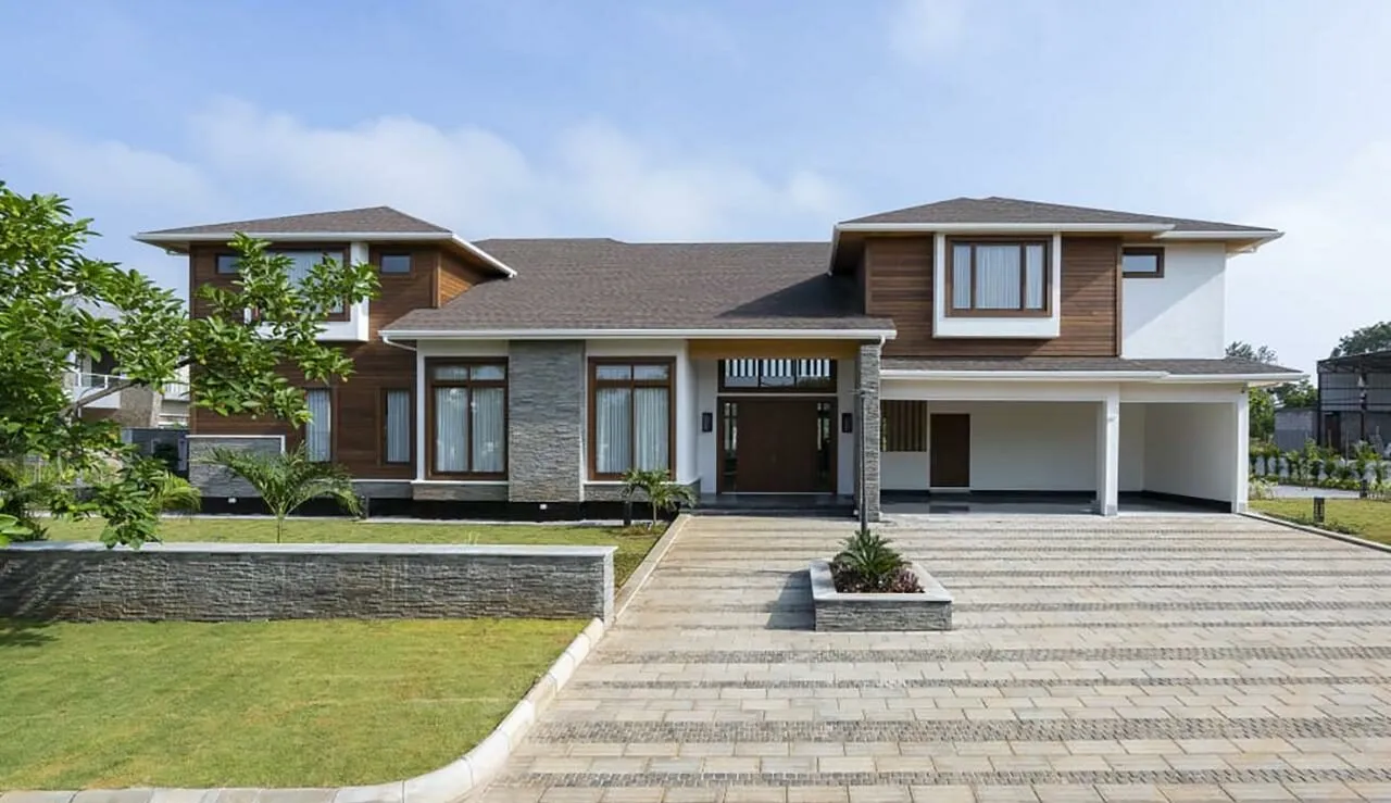 brown canadian wood villa with green garden and trees