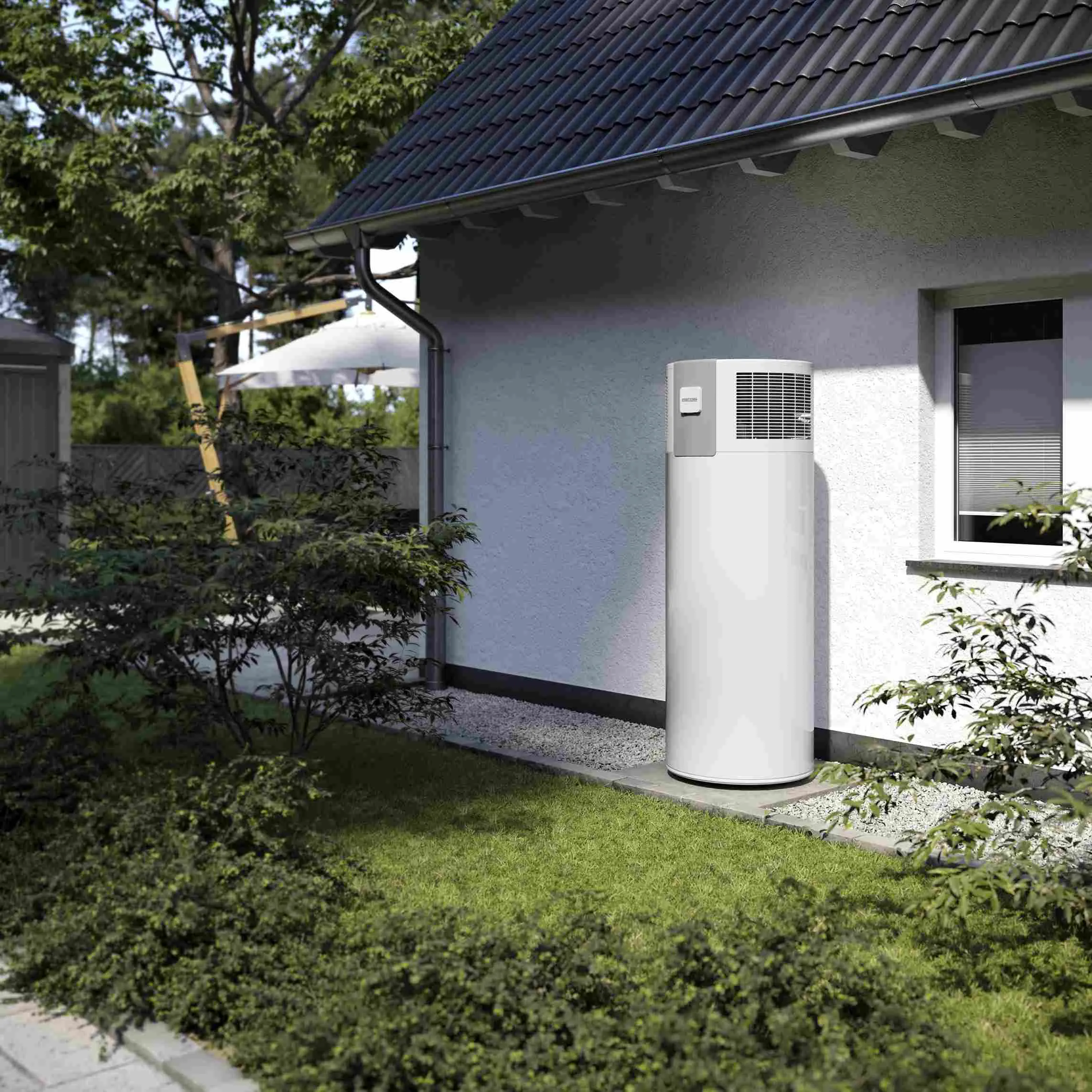 white sustainable domestic hot water heating pump system for outdoors in a house with a garden by Stiebel Eltron