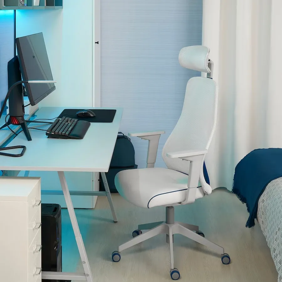 white coloured sviwel comfortable seat, bedroom with setup, blue lights
