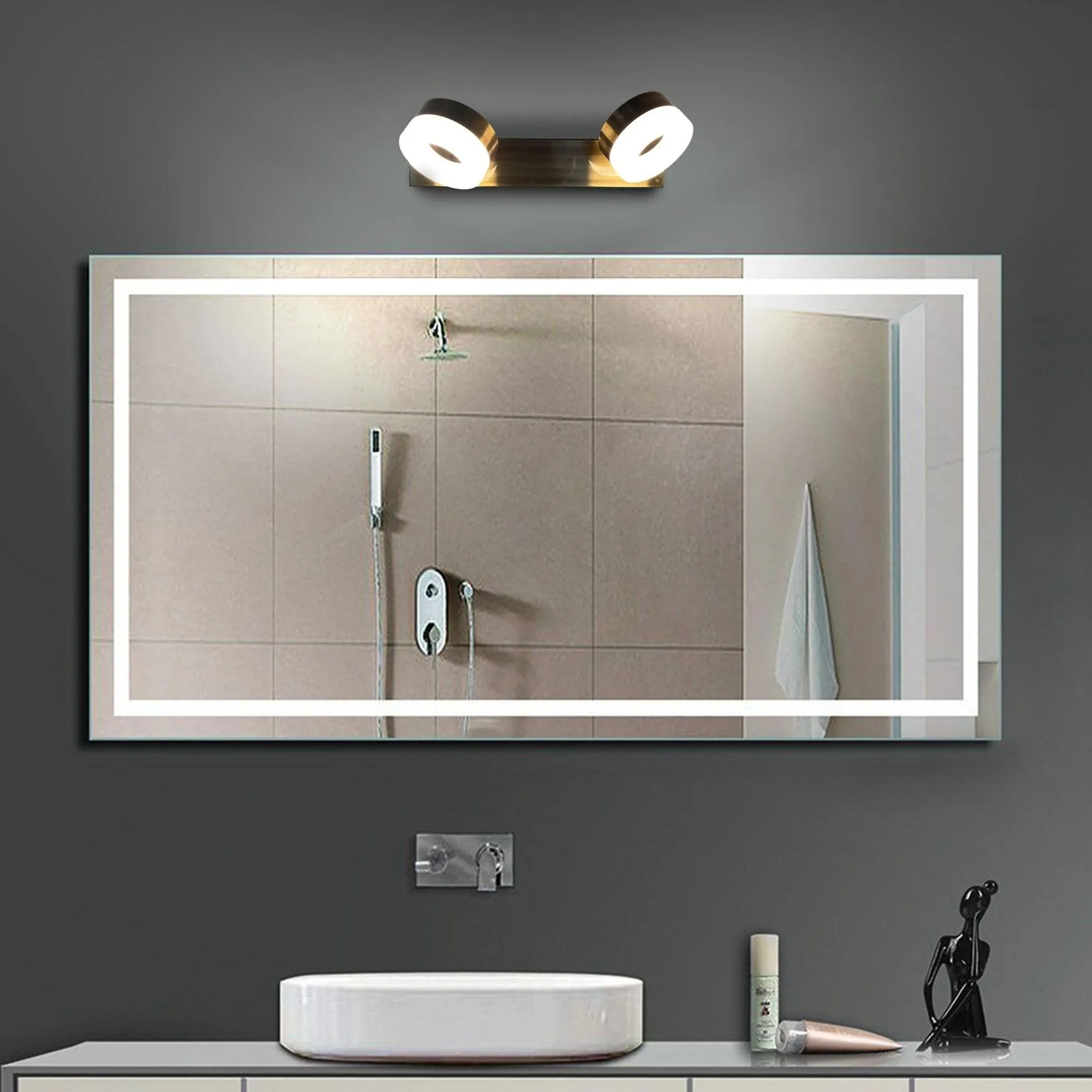 grey bathroom with a mirror sink and wall lights