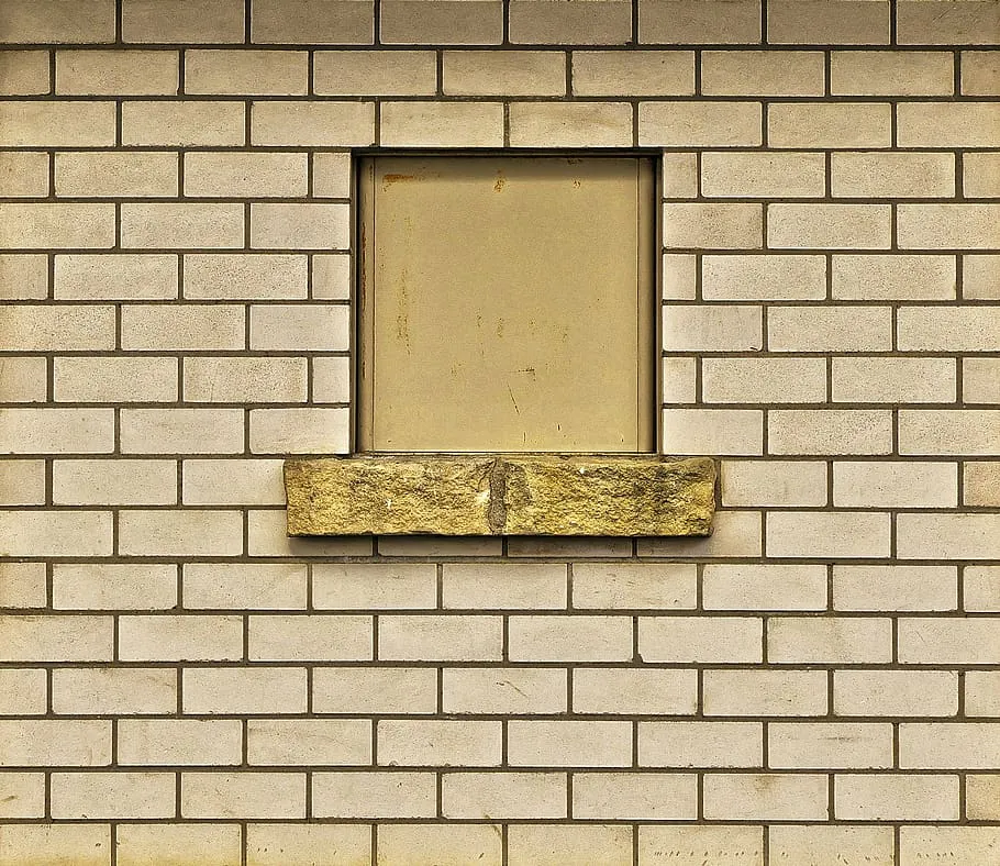 yellow fly ash bricks type in standard dimensions used for making wall with a window