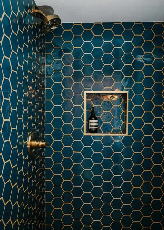 shower niche for storage in the bathroom, faucet, dark blue tiles, opulent look, shower, budget-friendly storage solution