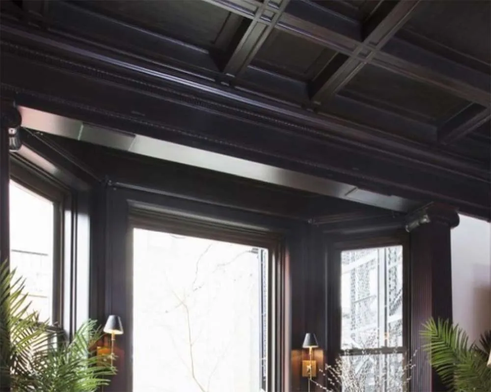 Dark timber coloured hallway ceiling with window