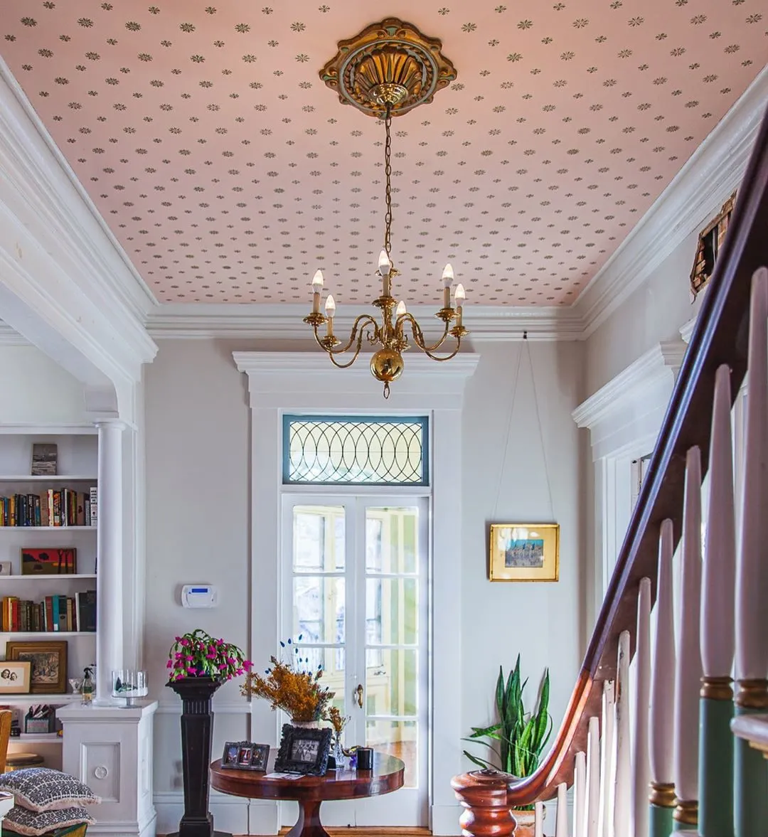 hallway ceiling designs with a decorative wallpaper.