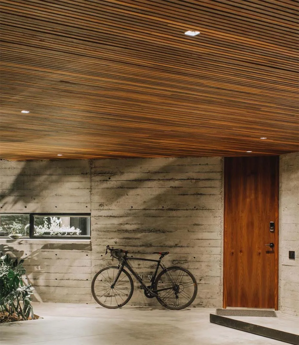 wooden hallway with a cycle in background.
