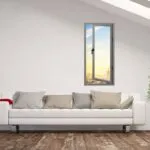 white living room with a white couch and a window
